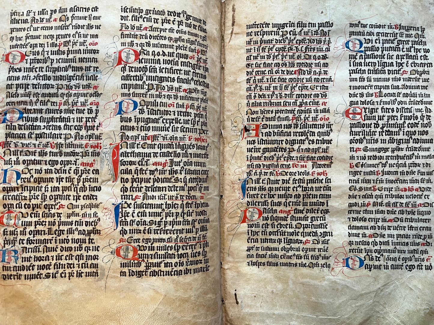 14th Century Missal Fragment of 28 leaves with beautiful decorative lettering