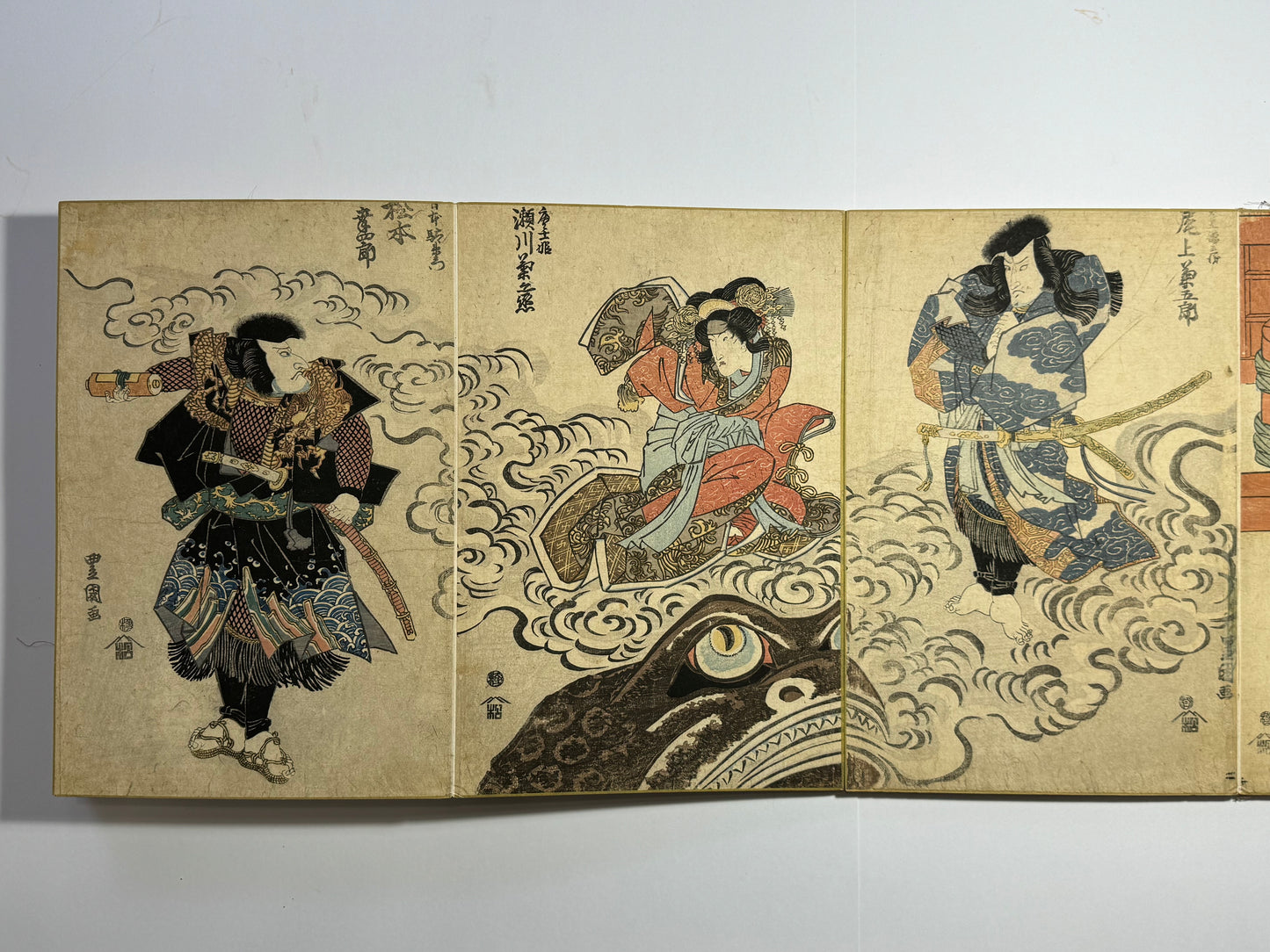Tenjiku Tokubei, Toad magic, and boats - a beautiful Ukiyo-e Japanese album with 6 rare triptchys and 2 tetraptychs by Toyokuni I, Kuniyasu and Kunisada - dated c1820