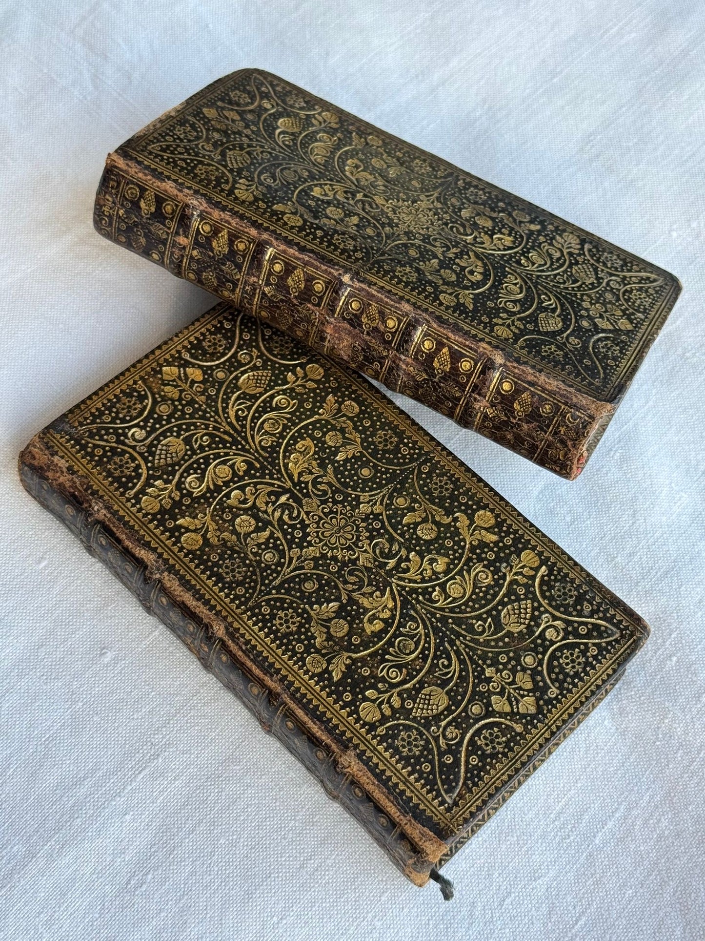 1743 Mini Bible set with elaborate foliate gilt binding and Dutch paper paste-downs.