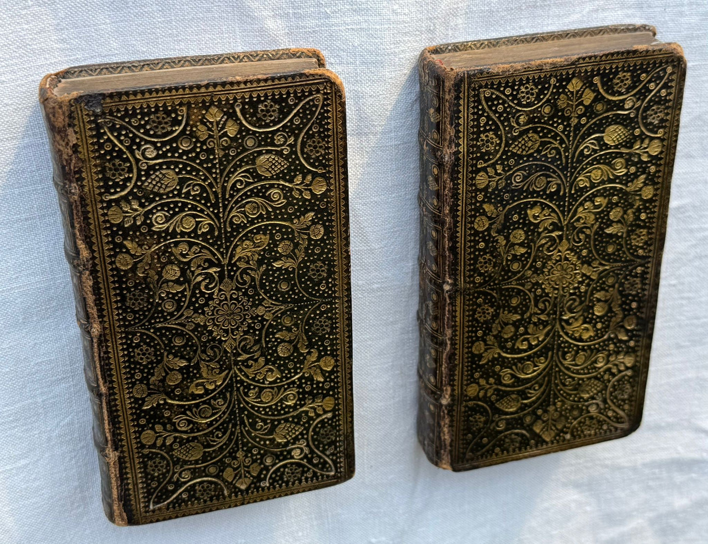 1743 Mini Bible set with elaborate foliate gilt binding and Dutch paper paste-downs.