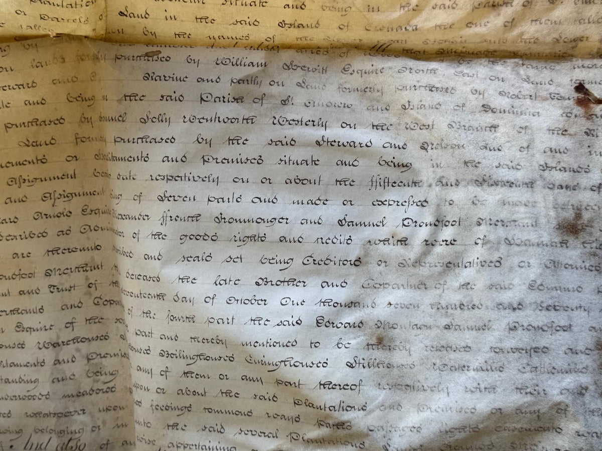 An archive of Nine vellum deeds documenting the enslaved populations of the Upper and Lower Pearl Estates in St Andrew's, Grenada, from 1826-1828, and their subsequent sale in 1830.