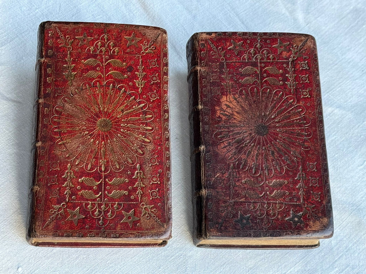 1764 Old and New Testament set in a contemporary red Morocco “Scottish Wheel” bindings